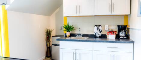 Fridge, microwave, stovetop, coffee/tea maker
