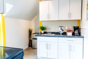 Fridge, microwave, stovetop, coffee/tea maker