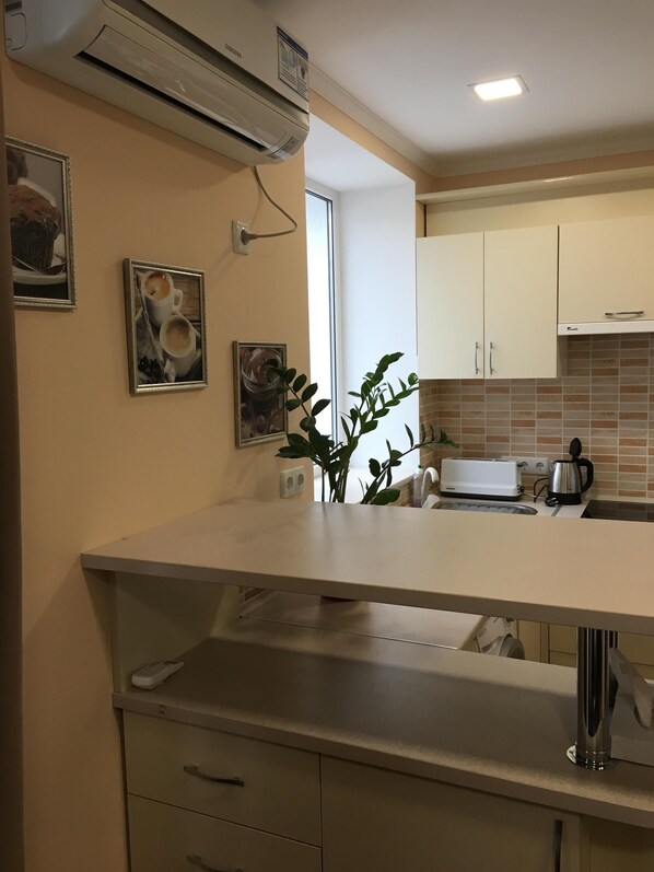 Fridge, microwave, stovetop, coffee/tea maker