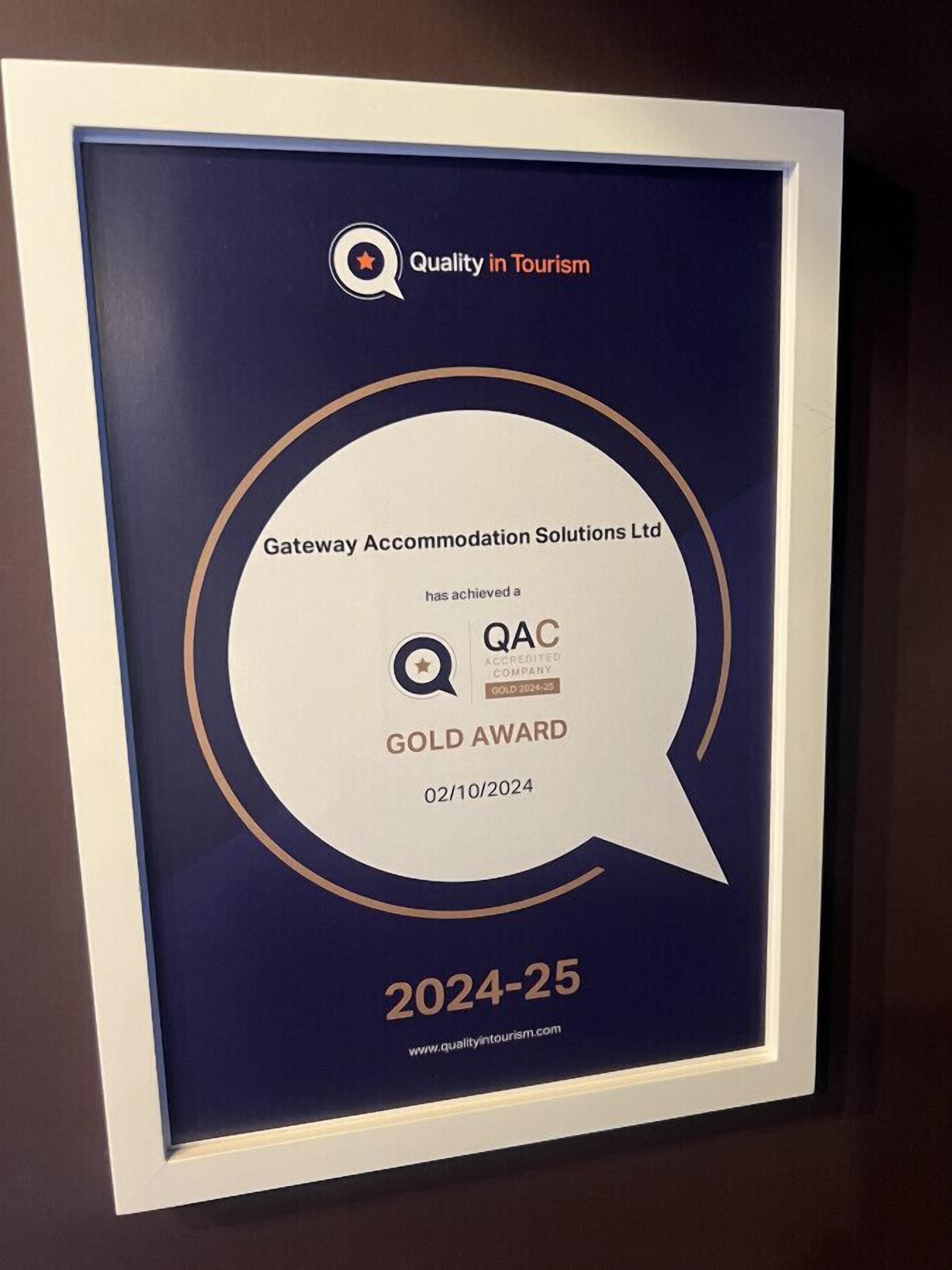 An award plaque for Gateway Accommodation Solutions Ltd, stating it has achieved a QAC GOLD AWARD for 2024-25.