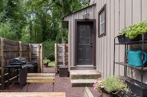 The back door leads to private back yard with gas grill and dining area.  - The Riverwood Cottage on Bucks County state park. (Upper Black Eddy)