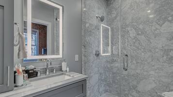 Combined shower/bathtub, hair dryer, towels, soap