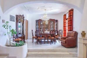 Enjoy meals in this elegant dining area with a large table and comfortable seating for six.