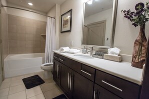 Combined shower/tub, hair dryer, towels, toilet paper