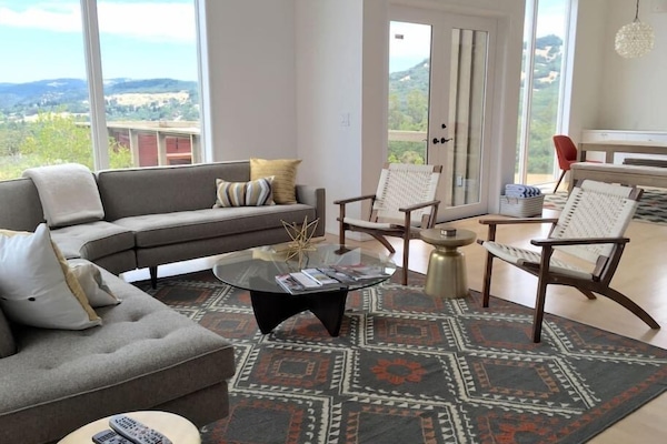 Living room with floor to ceiling windows