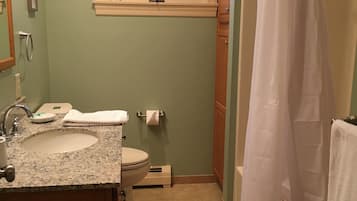 Combined shower/tub, hair dryer, towels, soap