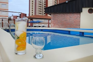 Seasonal outdoor pool, open 10:00 AM to 7:00 PM, pool loungers