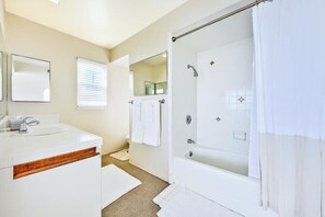 Shower, hair dryer, towels, shampoo