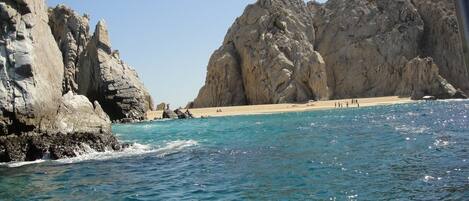 On the beach, sun loungers, beach towels