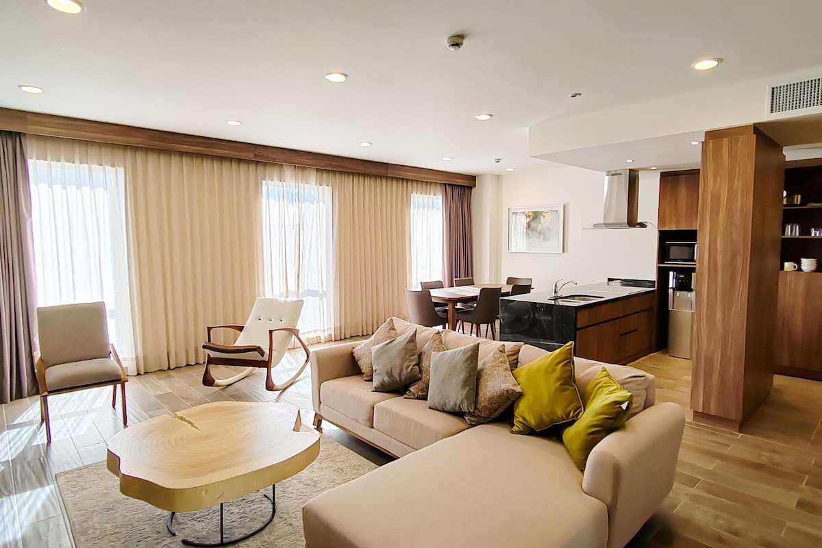 presidential suite, multiple beds, non smoking | living area | 49-inch tv with cable channels