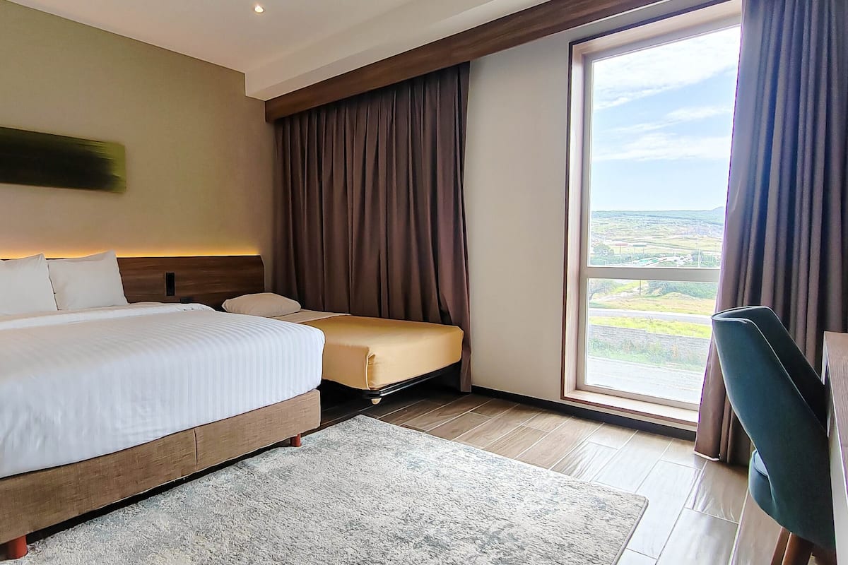 Deluxe Room, Multiple Beds, Non Smoking | 1 bedroom, in-room safe, desk, laptop workspace
