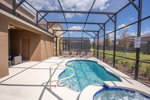 A swimming pool with a glass enclosure, lounge chairs, and a sign indicating a pool area. - Amazing 6bds Single Home With Private Pool St7040 (Davenport)