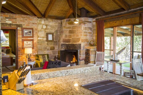 Monkey Place Country House - Unique, sandstone 4 bdrm home with pool, spa and awesome fireplace!