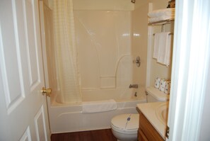 Combined shower/bathtub, towels, soap, toilet paper - Two Bedroom Cabin With Covered Back Deck- no cleaning fees! @LakePointe Resort (Russell Springs)