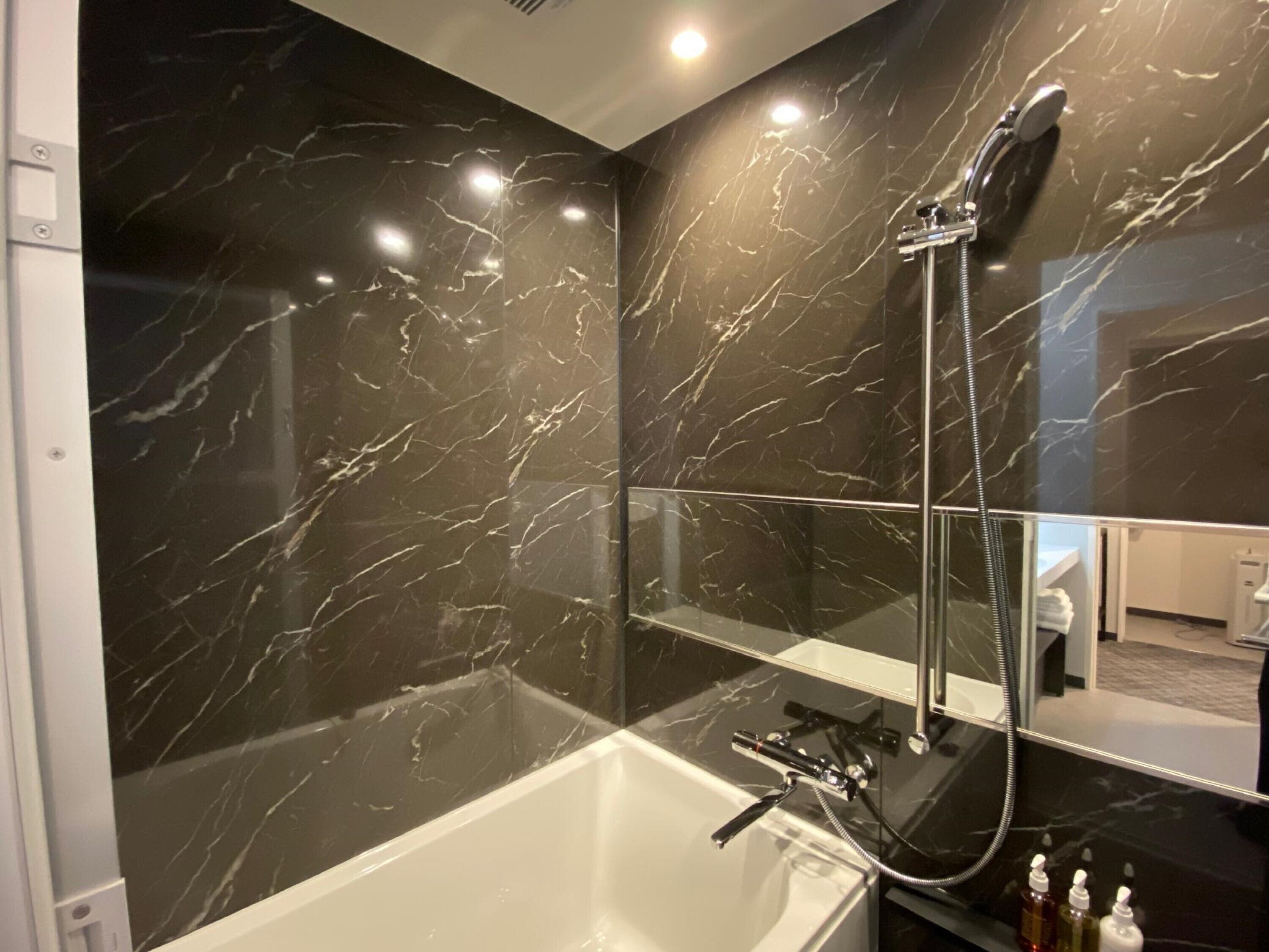 hydromassage showerhead, free toiletries, hair dryer, slippers