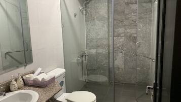 Shower, free toiletries, hair dryer, slippers