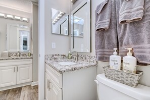 Combined shower/tub, hair dryer, towels, soap