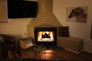 Smart TV, fireplace, DVD player, books