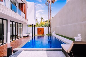 Outdoor pool, a heated pool, pool loungers