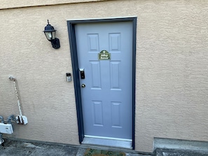 A door with a sign indicating 'Hilltop Retreat.'