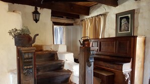 A rustic staircase with a wooden handrail, a potted plant, and a framed owl picture on the wall. - Bronte Manor, Wuthering Heights ~ min. 4 people - dog friendly (Clare)