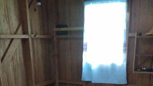 Two wooden beds with white linens and a window with a white curtain. - Serah's Lagoon Hideaway (Auki)