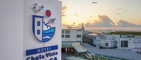 A hotel sign with a logo featuring a boat and stars, and the name "Chula Vista SENAGA HOTEL".