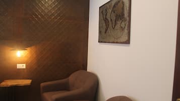 Deluxe Double Room | Living area | 32-inch LCD TV with cable channels, TV