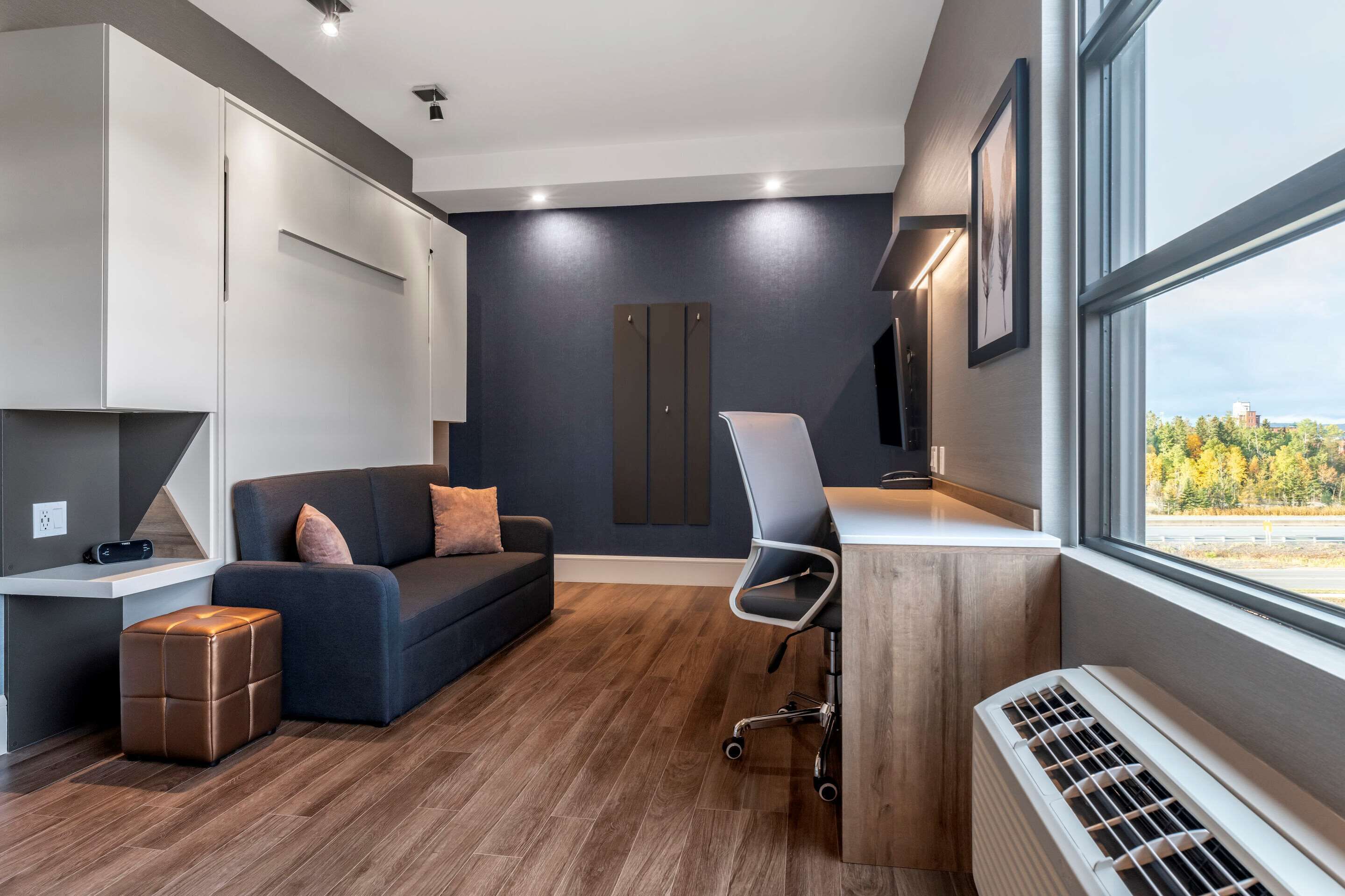 suite, 1 king bed, non smoking | desk, soundproofing, iron/ironing board, free cots/infant beds