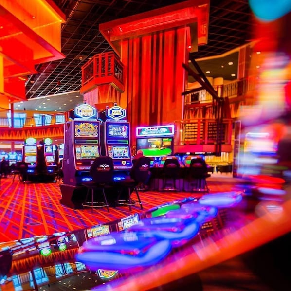 A casino with slot machines and a vibrant, colorful interior. - Quality Hotel & Conference Centre (Edmundston)