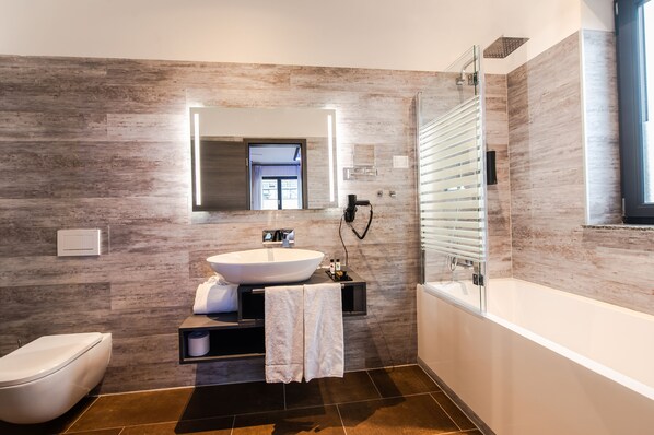 Separate tub and shower, hair dryer, towels, soap