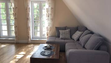 Apartemen | Area keluarga | TV layar datar