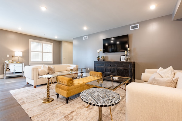 Open-concept living, kitchen, dining with ample seating. Enjoy a 58” Samsung Smart 4K TV with streaming and DIRECTV Entertainment. Lounge on the sofa and cozy chairs after a day in NOLA! Dining table and bar seating for 9. Plenty of natural light!