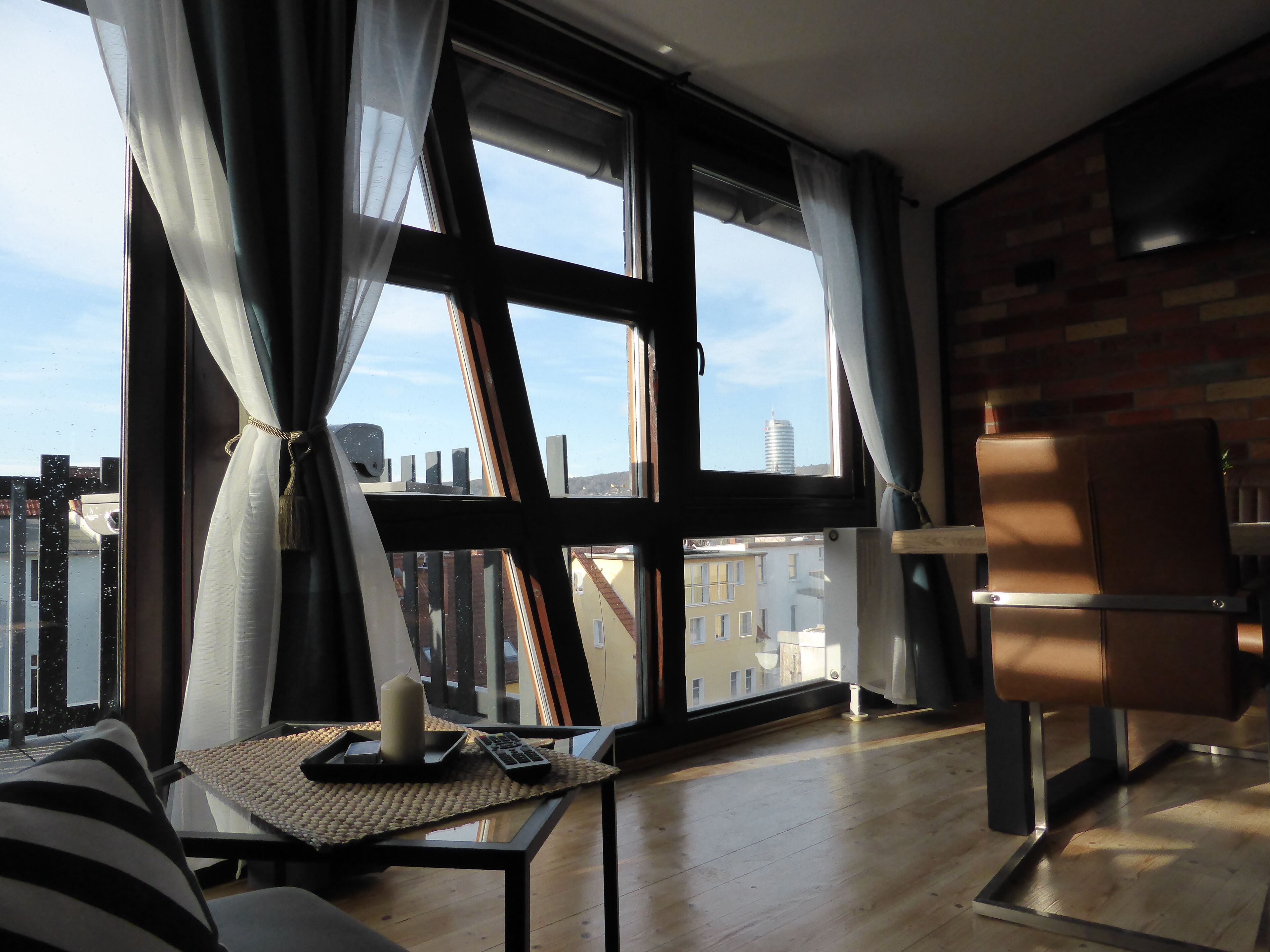 Panoramic Apartment (incl. Cleaning Fee) | Living area | 102-cm flat-screen TV with satellite channels, TV, fireplace