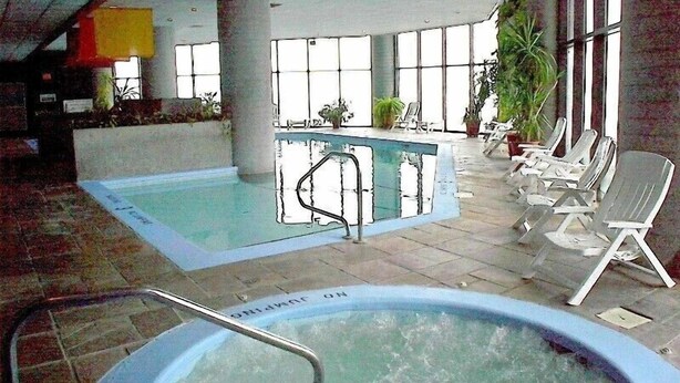An indoor swimming pool with lounge chairs and a hot tub. - Luxury Condo  in Spectacular  Sugar Mountain  North Carolina (Sugar Mountain)