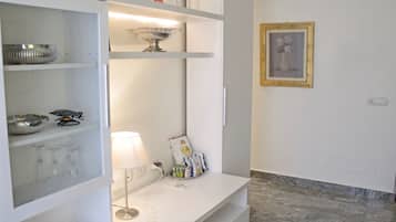 Executive Studio Suite | Living area | 42-inch flat-screen TV with digital channels, TV