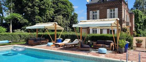 Seasonal outdoor pool, open 9:00 AM to 8:30 PM, pool umbrellas