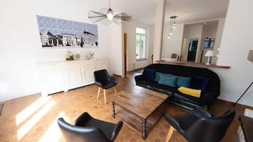 Quadruple Room | Living area | Flat-screen TV