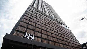 A tall building with a grid-like facade and the letters "ESI" visible on the lower part. - Cozy Family Suite Apartment (Kuala Lumpur)