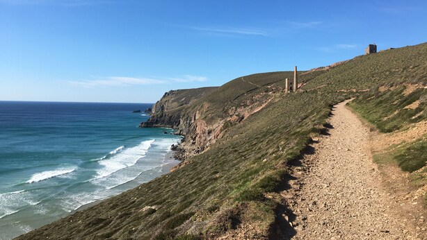 A coastal path with a rocky terrain and a clear view of the ocean. - A substantial six double bedroom property located in the heart of St Agnes. (St Agnes)