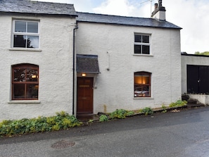 A two-story building with a white exterior, a dark roof, and multiple windows. - 1 bedroom accommodation in Lindale, near Grange-over-Sands (Lindale, near Grange-over-Sands)