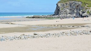A beach with rocky terrain and a cliff. - 2 bedroom accommodation in Mount Hawke, near Redruth (Mount Hawke, near Redruth)