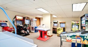 Play classic arcade games like Crazy 8 Ball and South Park in this lively game room.