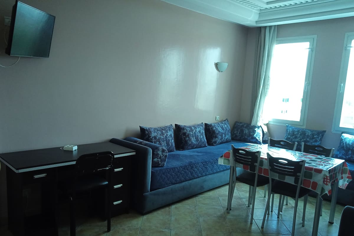 Standard Apartment | Living area | 32-inch LCD TV with satellite channels, TV