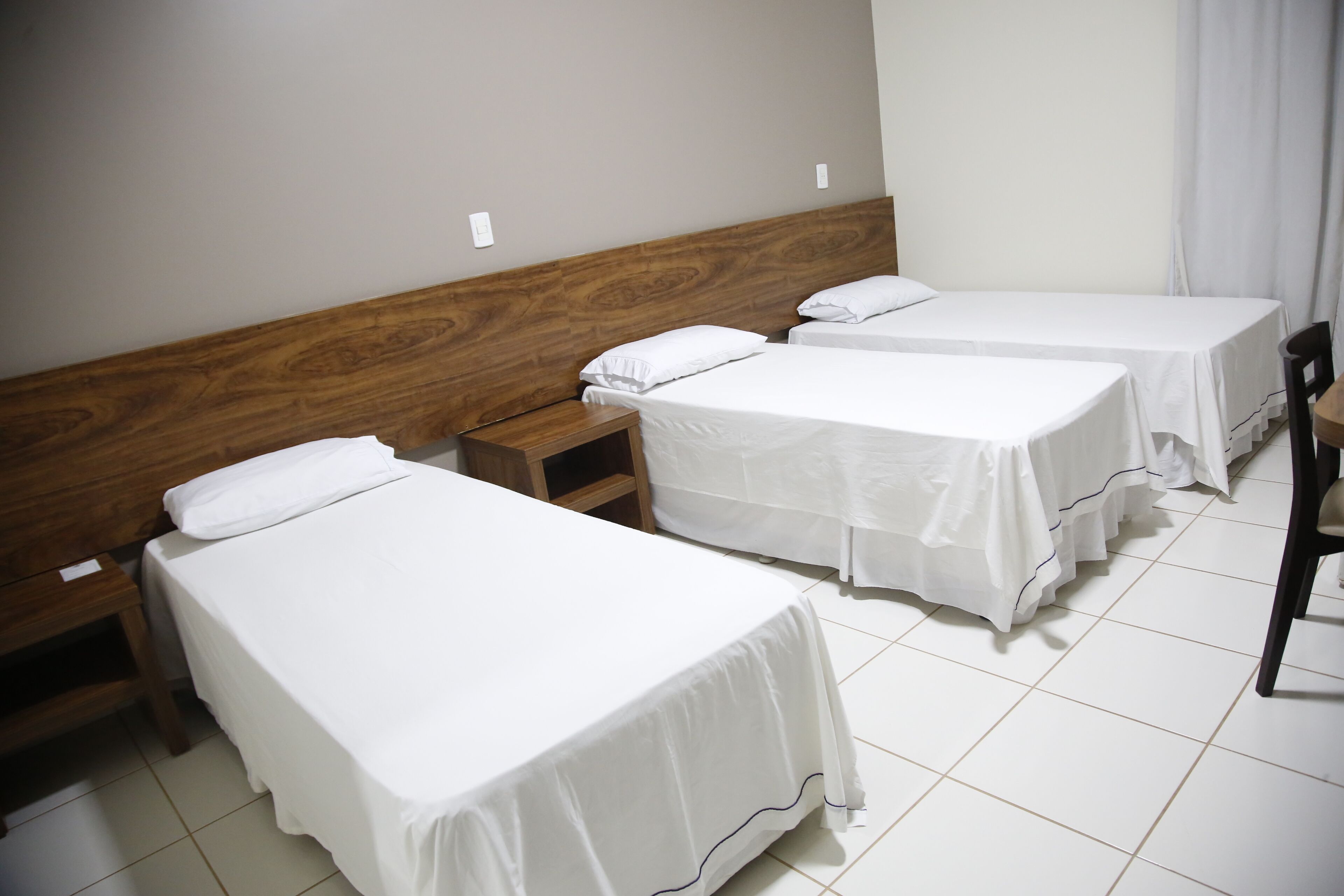 deluxe triple room | minibar, desk, blackout curtains, iron/ironing board