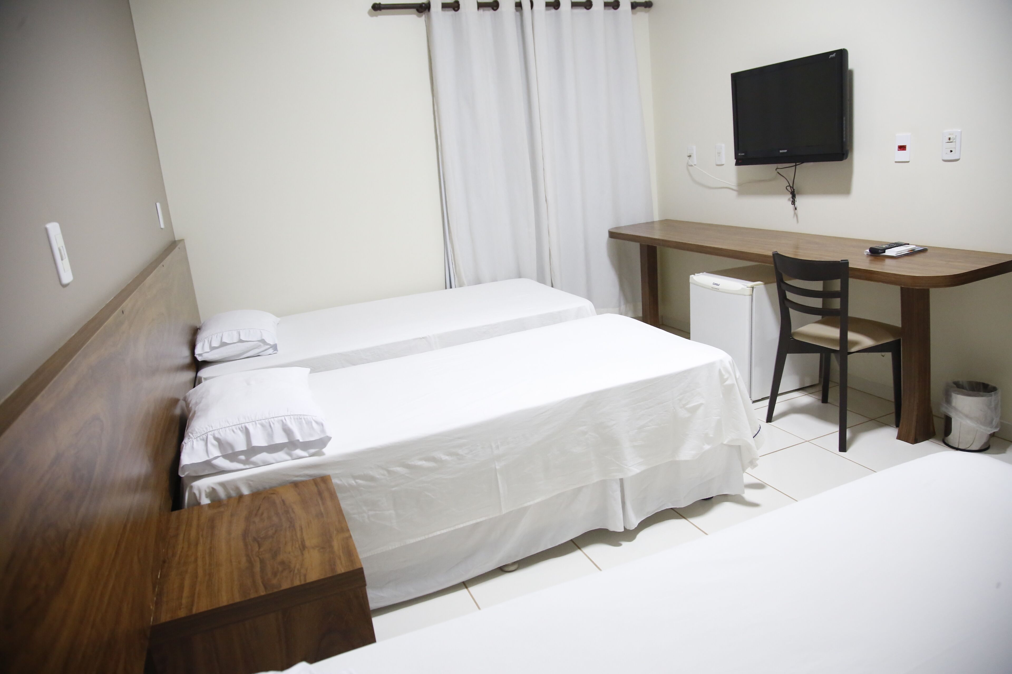 deluxe triple room | minibar, desk, blackout curtains, iron/ironing board