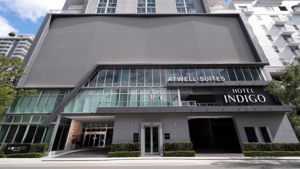 A modern hotel building with ATWELL SUITES and HOTEL INDIGO signage. - Hotel Indigo Miami Brickell by IHG (Miami)