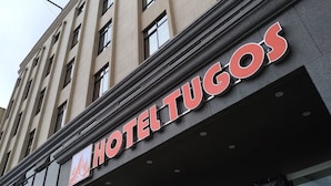 A hotel sign with the name "HOTEL TUGOS" in bold letters. - Hotel Tugos (Baguio)