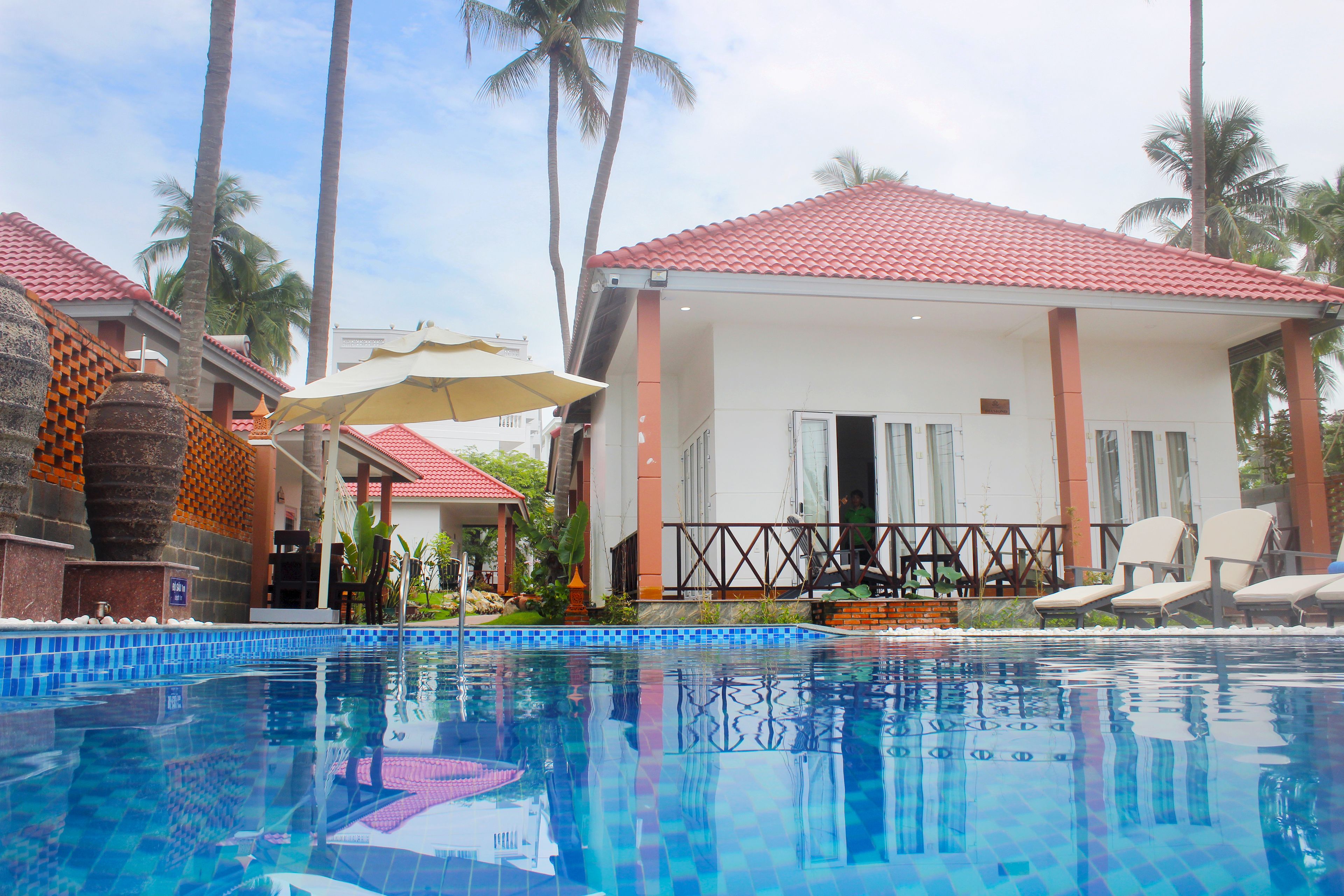 Outdoor pool, open 9:00 AM to 9:00 PM, pool umbrellas, sun loungers