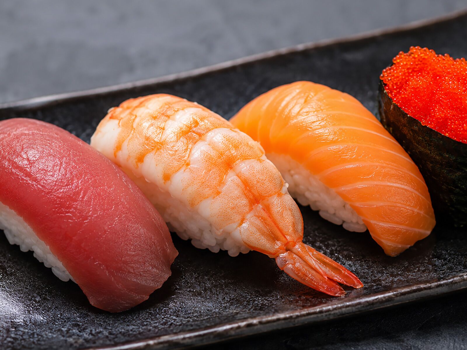 A plate with three types of sushi.